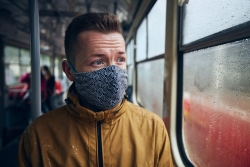 man wearing face mask in public transportation themes social distancing and personal protection t20 e9NmLa